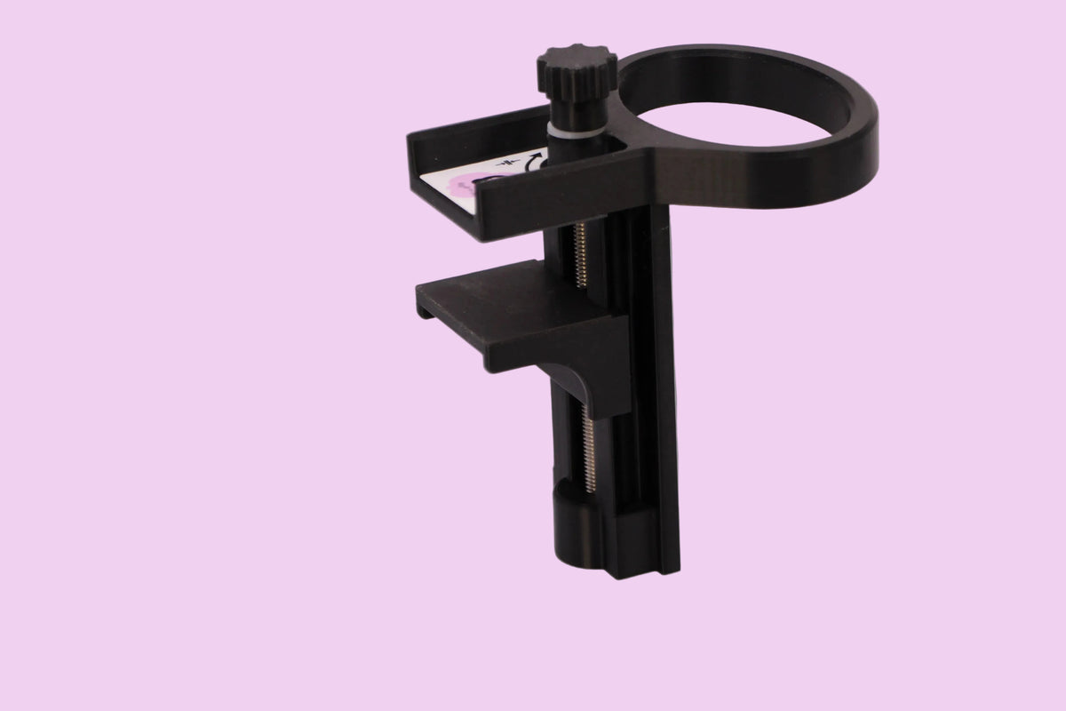 A black plastic ring with adjustable clamp with a thumbscrew and a small horizontal side, shown on a plain light gray studio background.